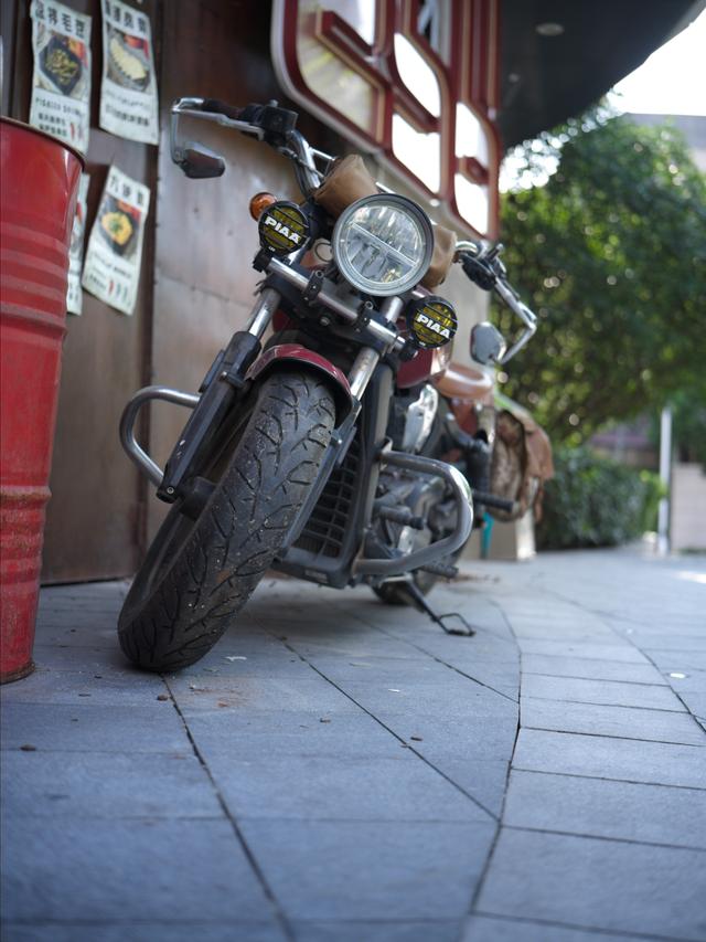 the classic motorcycle in the front door of a bar downtown